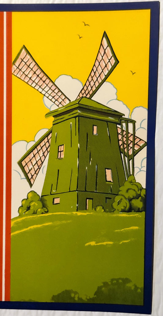 Vintage crate label featuring a green Dutch windmill with four sails against a bright yellow sky with white clouds and flying