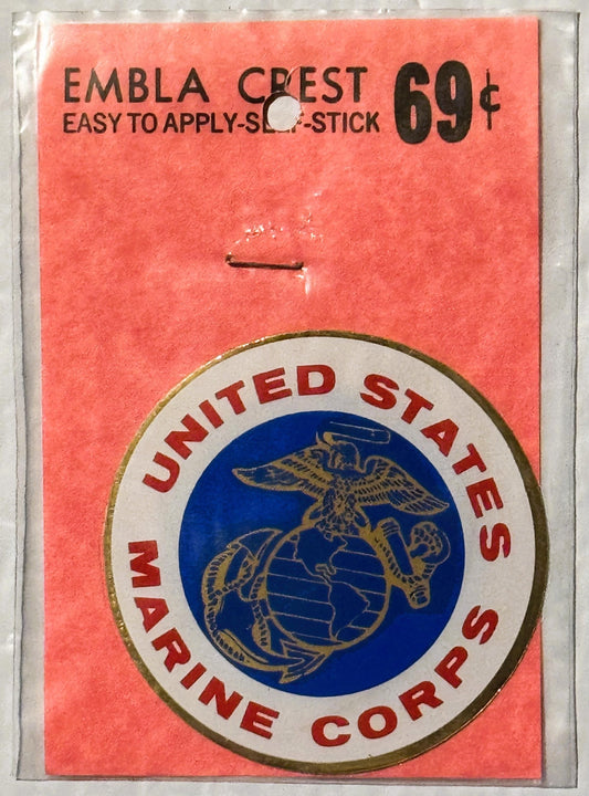 Vintage USMC decal on coral card with gold-bordered circular emblem featuring eagle and globe, priced 69 cents, easy-to-apply
