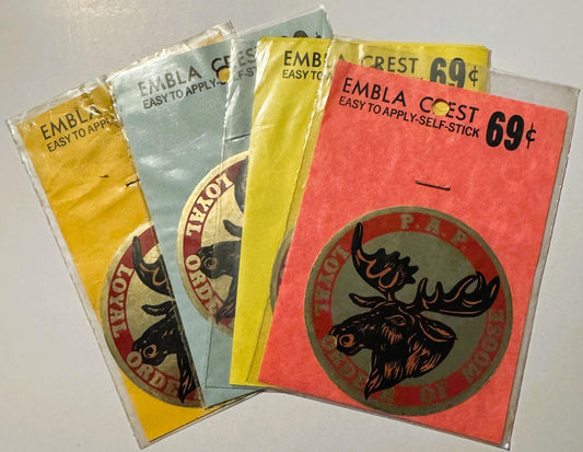 Four vintage Embla Crest self-stick decals in yellow, light blue, and red with moose lodge emblems, priced at 69 cents each
