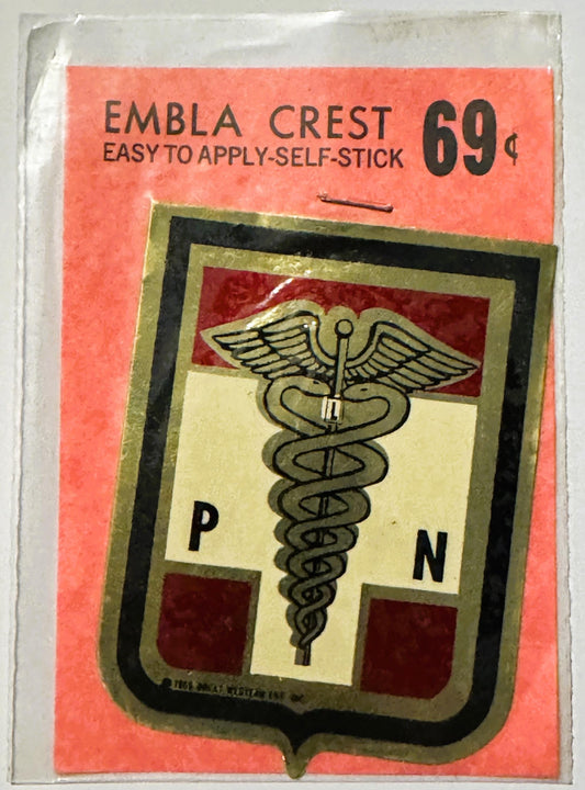 Vintage self-stick Embla Crest decal with medical caduceus symbol, "P" and "N" letters, priced 69 cents, on coral packaging.