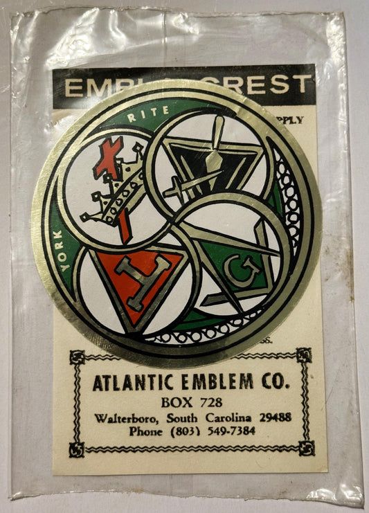 Vintage York Rite Freemasonry decal in plastic packaging showing circular emblem with red and green sections and Masonic symb
