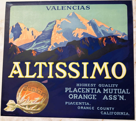 Vintage fruit crate label featuring snow-capped mountains, "Altissimo" in gold lettering, and a Sunkist orange illustration o