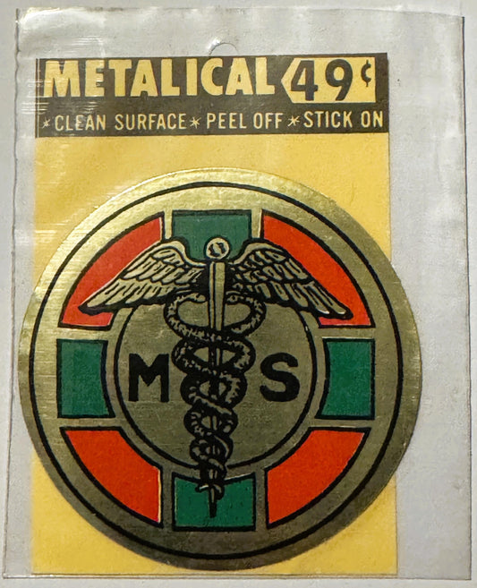 Vintage metallic medical caduceus decal with red and green sections, yellow backing, priced at 49 cents, instructions read "C