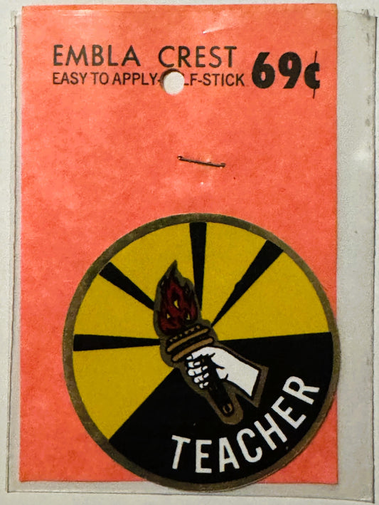 Vintage orange decal with torch and "Teacher" emblem, priced 69 cents, easy-to-apply stick-on style