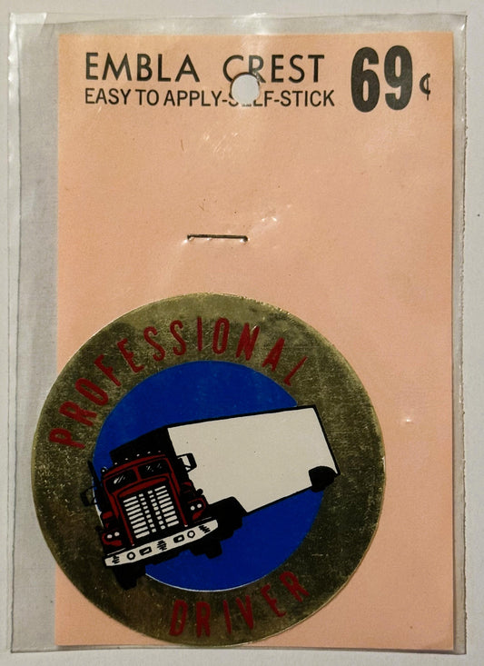Vintage self-stick emblem crest decal on peach card showing red semi truck on blue circle, priced 69 cents, unopened in plast