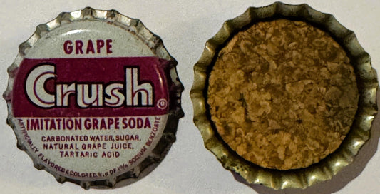 Vintage Grape Crush bottle cap showing front label with purple and white design and reverse cork-lined interior, displayed fl
