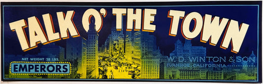 Vintage fruit crate label featuring "Talk O' The Town" in large cream letters with red outline, cityscape illustration, and "