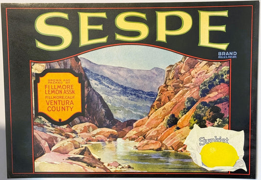 Vintage Sespe Brand Sunkist lemon crate label featuring a mountain canyon landscape with a stream, yellow text, and Sunkist l