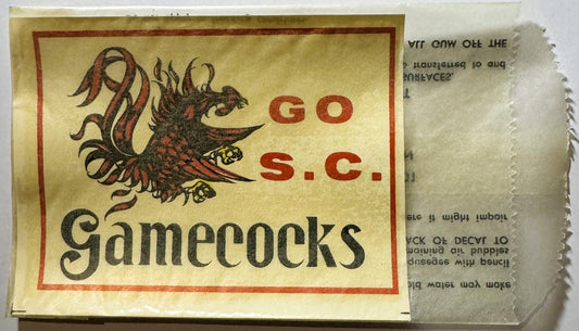 Vintage South Carolina Gamecocks water-transfer decal with red gamecock illustration and text on cream background, shown