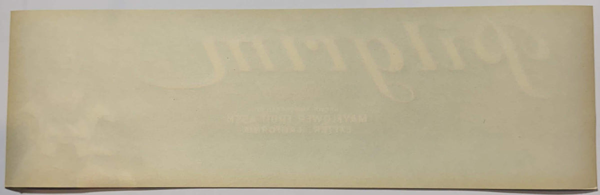 Cream-colored vintage crate label with faded embossed text and imagery, shown flat against neutral background