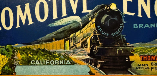 Vintage locomotive crate label featuring a steam train with yellow cars against dark blue sky, grapes and "California" text v