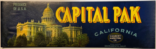 Vintage fruit crate label featuring Capitol building in gold on dark blue background, "Capital Pak" text in yellow, Lambert M