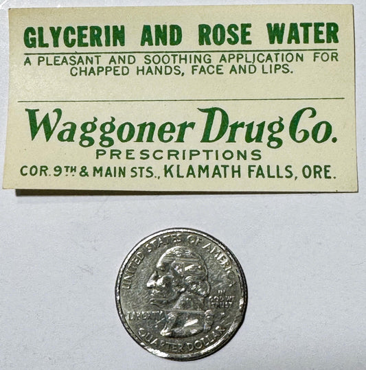 Vintage cream-colored label for glycerin and rose water from Waggoner Drug Co., Klamath Falls, Oregon, shown with a quarter c