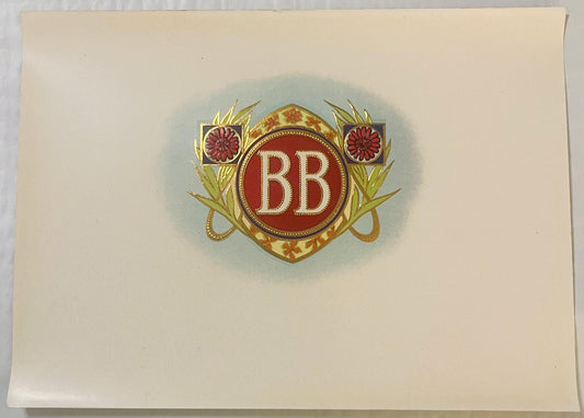 Ornate cigar label with "BB" initials in red circle, flanked by purple flowers and gold leaf design on cream background