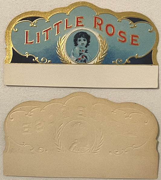 Two-piece antique cigar box label with gold embossed borders, blue top panel reading "LITTLE ROSE" in red letters with portra
