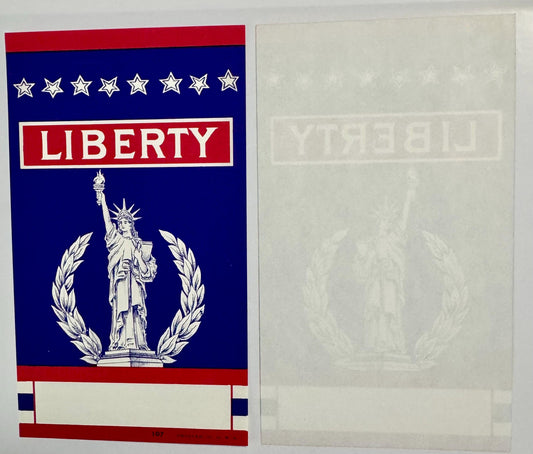 Vintage broom label with red, white and blue patriotic design featuring Statue of Liberty, stars, laurel wreath, and "LIBERTY