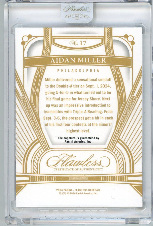 Reverse side of 2024 Panini Flawless Aidan Miller rookie card showing gold-bordered design with player biography text and Certificate of Authenticity.