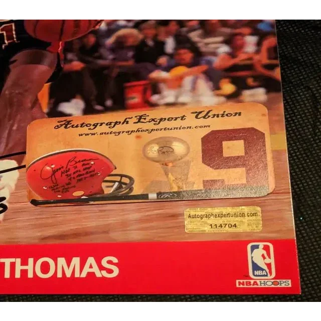 Autographed 8x10 photo of Isiah Thomas with sports memorabilia and serial sticker