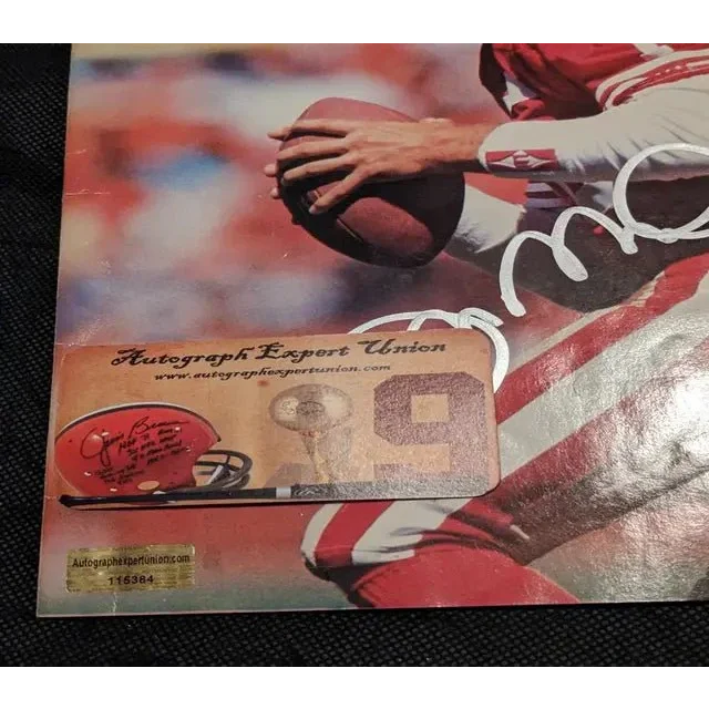 Joe Montana auto signed football helmet with Beckett sticker on football player poster