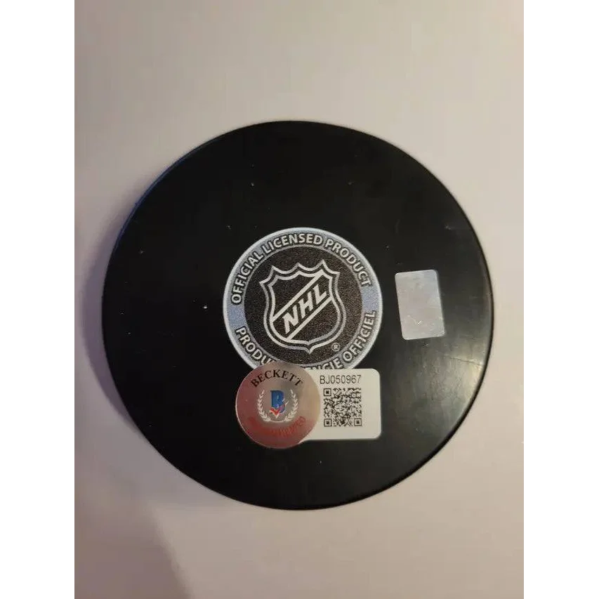 Autographed hockey puck with NHL and Beckett stickers from Joseph Blandisi New Jersey Devils