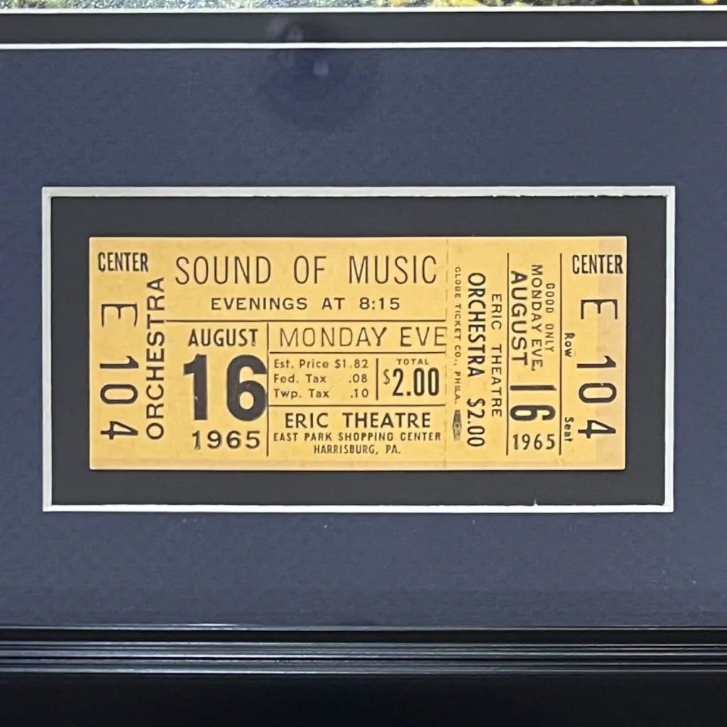 Yellow vintage ticket for the 1965 musical sound of music displayed with julie andrews autographed 11x14 photo deluxe frame