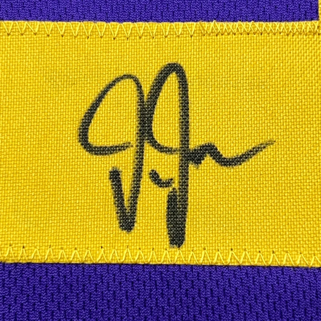 Yellow fabric patch with black cursive signature on Justin Jefferson Vikings jersey