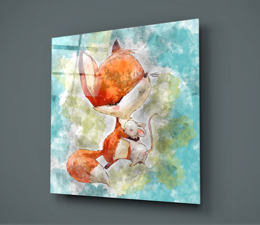 Glass wall art panel displaying a watercolor illustration of an orange fox holding a red balloon with a small white mouse nearby, mounted at an angle against a gray wall.