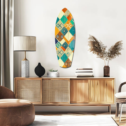 Geometric Diamond Surfboard Glass Wall Art displayed above wooden credenza in modern living room setting with teal, orange, cream, and navy diamond pattern.