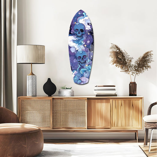 Indigo Cloud Skulls Surfboard mounted on white wall above wooden mid-century credenza in modern living room setting.
