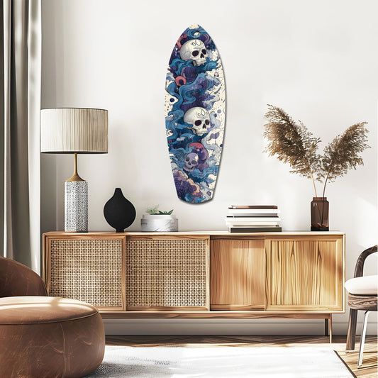 Blue and purple wave-patterned surfboard with skull motifs mounted on white wall above wooden mid-century credenza.