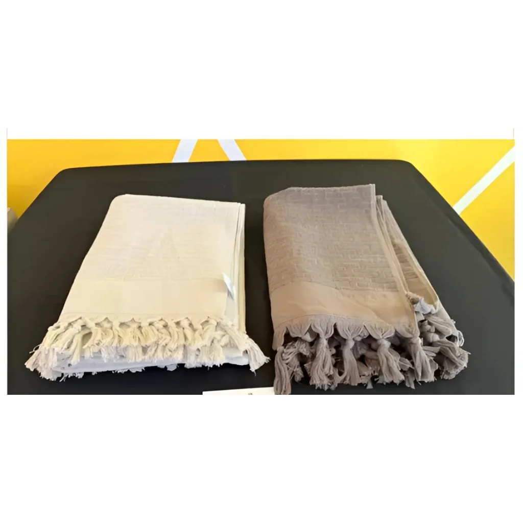 Two fringed peshtamal Turkish bath blankets in cream and taupe from Haremlique Peshtamal Turkish