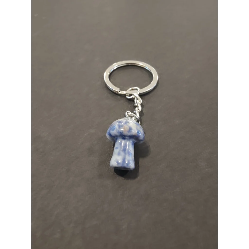 Vibrant blue stone mushroom keychain with silver ring and chain
