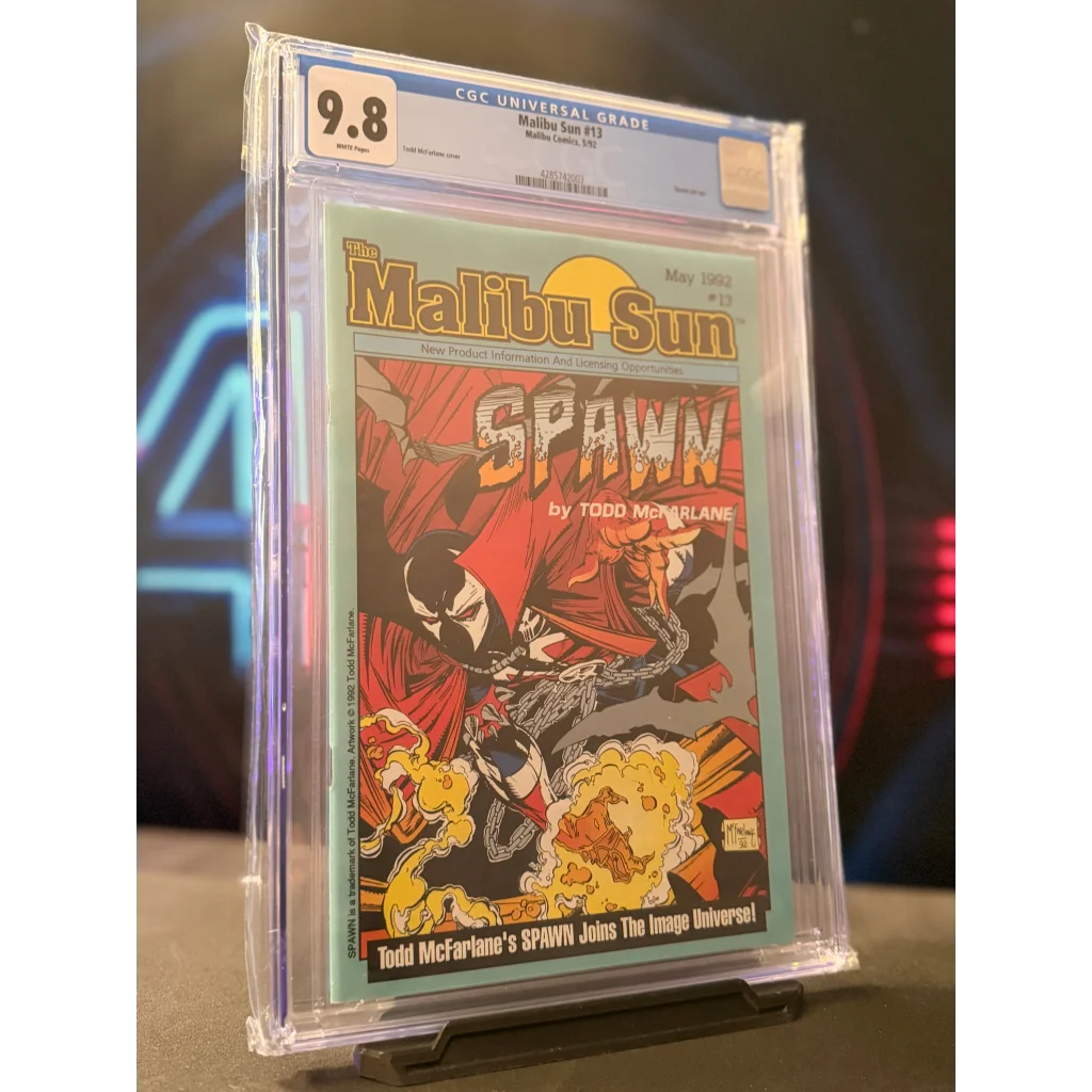 A 1987 malibu sun #13 comic book graded cgc 9.8 featuring spawn in red cape and black mask on fiery cover by todd mcfarlane