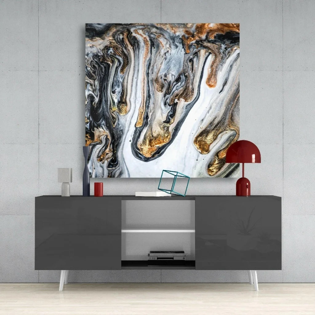 Stunning gold marble glass wall art with swirling black and white patterns