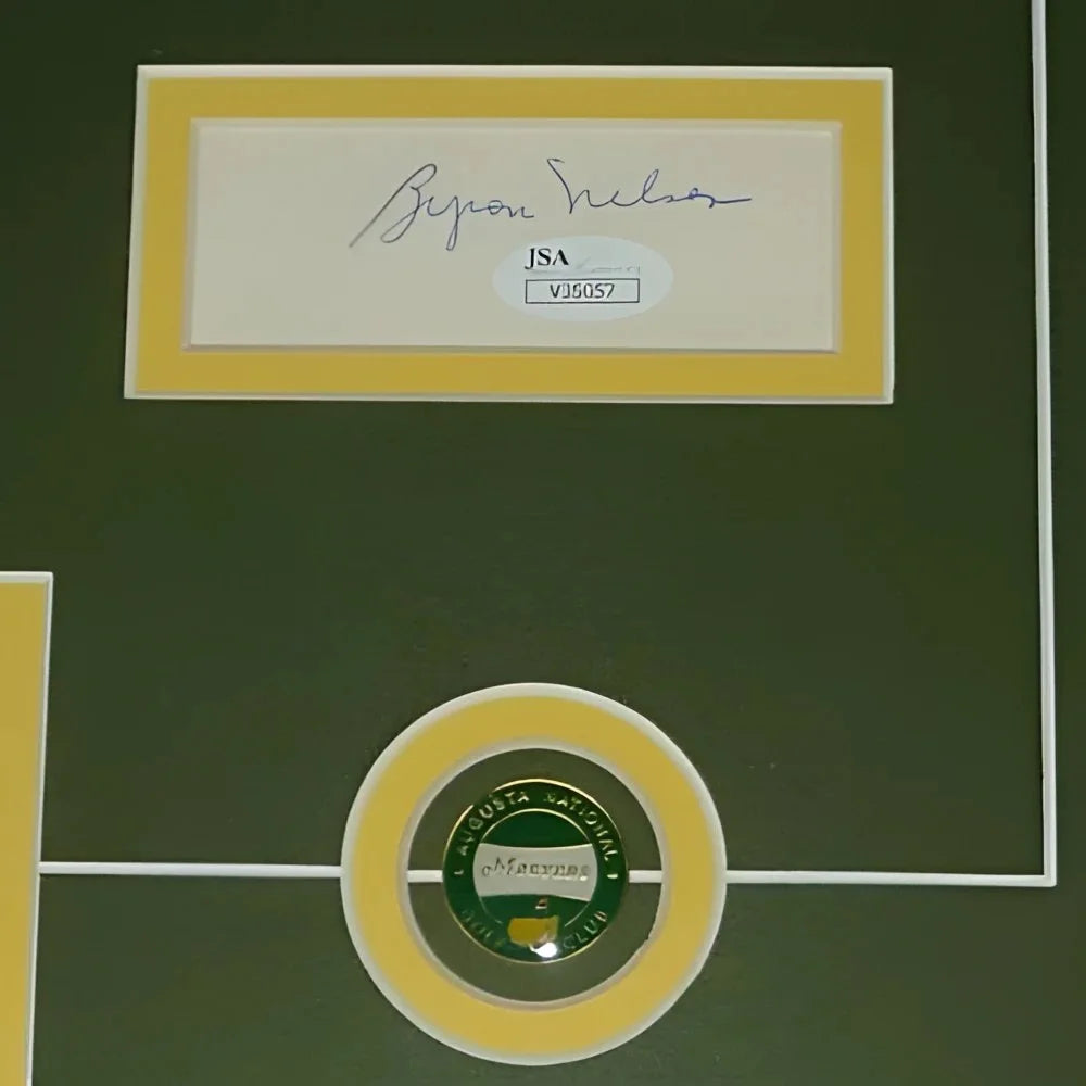 Gold-framed green golf ball with Augusta National logo and JSA authentication in deluxe framed piece