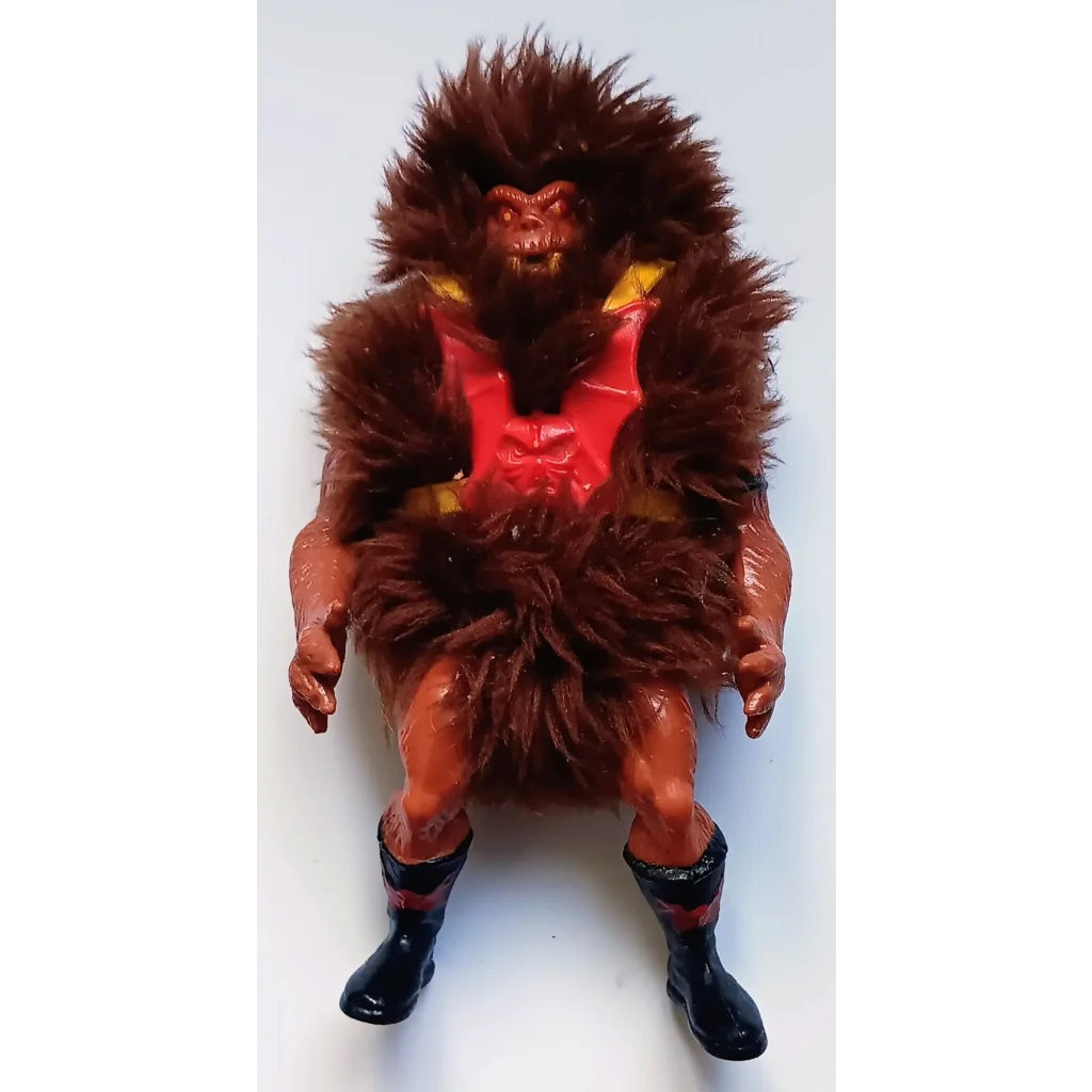 Red Grizzlor Masters of the Universe action figure with fur and black boots