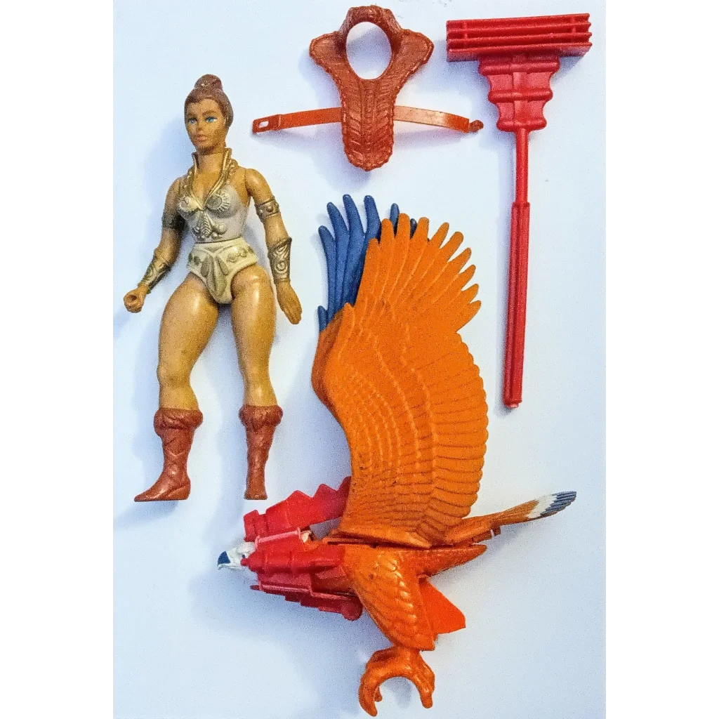 Vintage 1980s She-Ra universe action figures with Zoar orange blue bird, headband staff