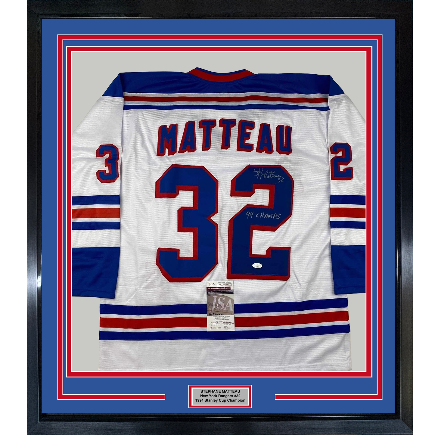 Framed white New York Rangers hockey jersey number 32 with "MATTEAU" nameplate and autographed inscription, displayed front-facing in blue and red matting.