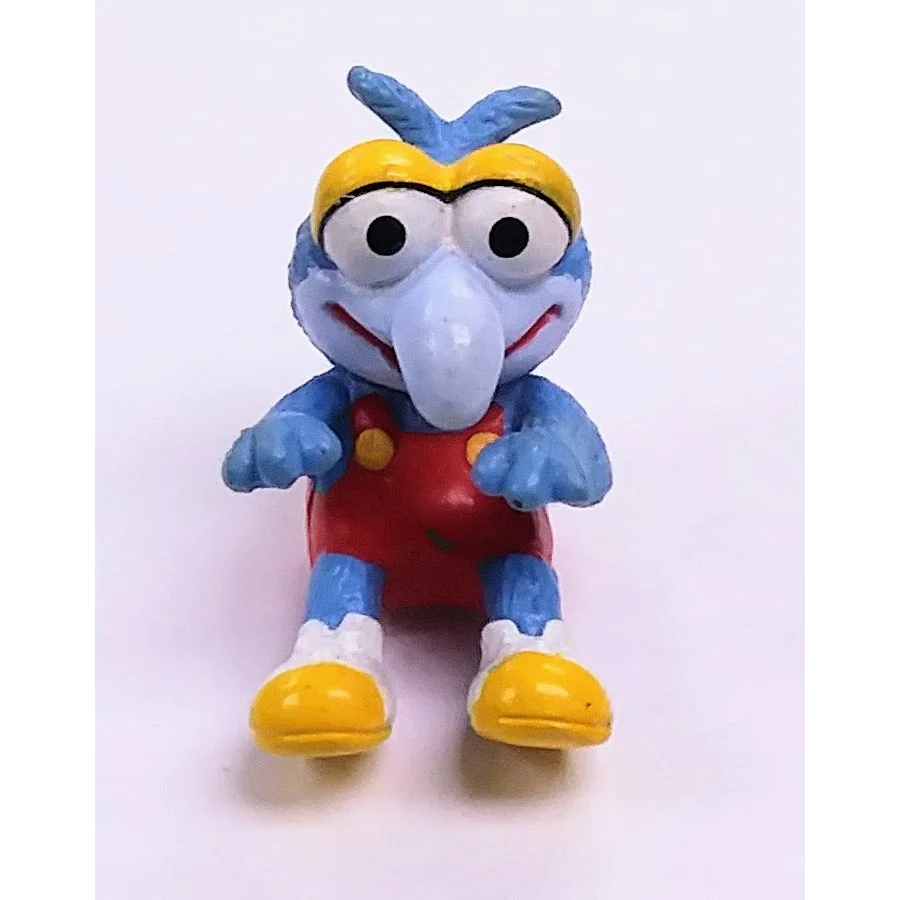Vintage 1986 Muppet Babies Gonzo Happy Meal toy: blue plastic elephant with yellow feet and red overalls