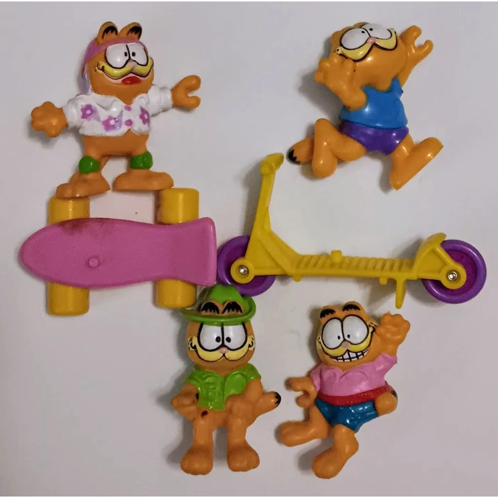 1988 Garfield happy meal toy set with colorful skateboard and scooter figures