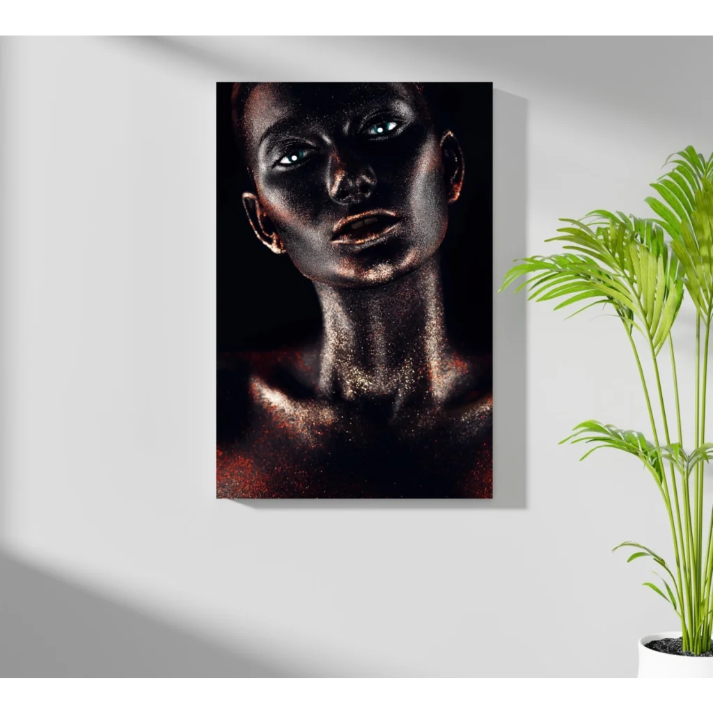 Black canvas portrait of woman with metallic gold glitter skin and glowing blue eyes