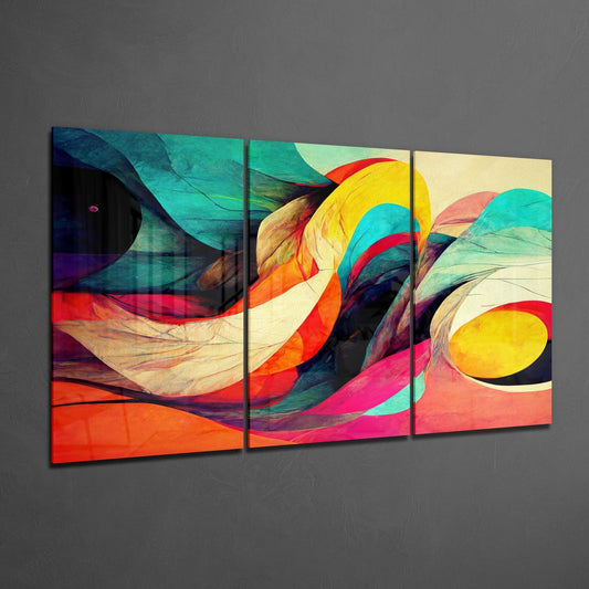 Three-panel glass wall art displaying vibrant swirling abstracts in orange, red, yellow, turquoise, and pink with circular elements, displayed at an angle against a gray wall.