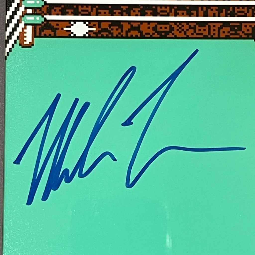 Mike Tyson autographed Nintendo Punch-Out Gameboy framed display with blue ink signature on teal card and pixelated graphics