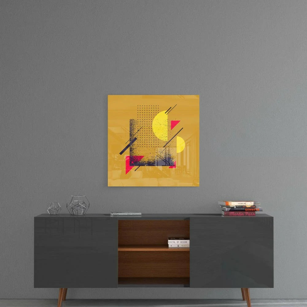 Vibrant yellow geometric glass wall art with bold shapes