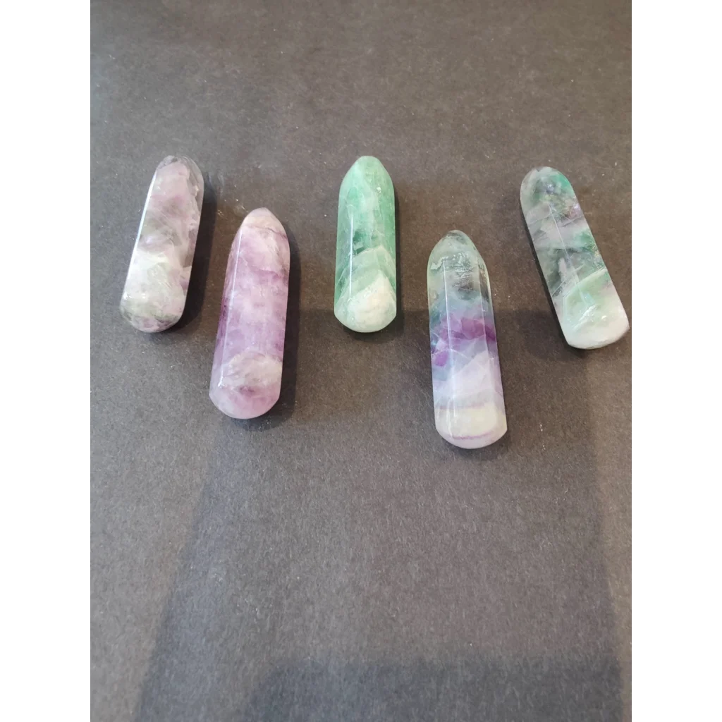 Five multi color fluorite point wands in green, purple, white