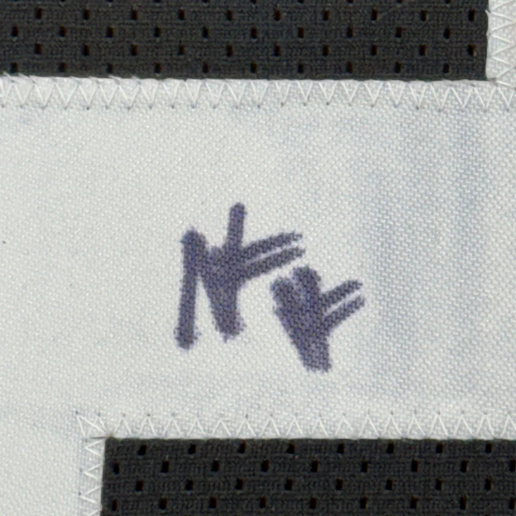 White fabric with a purple NY logo on Najee Harris Steelers jersey for your man cave