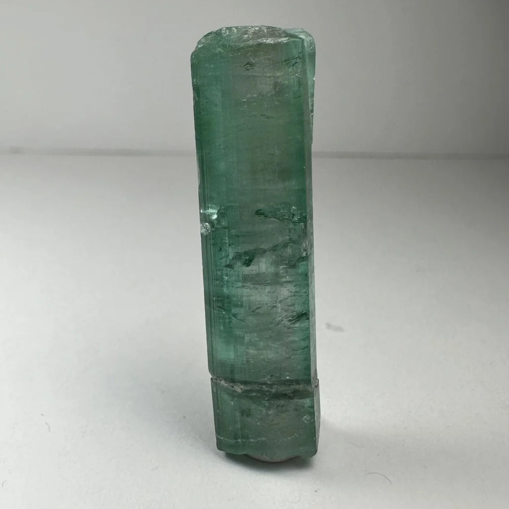 Translucent emerald green indicolite tourmaline gemstone crystal