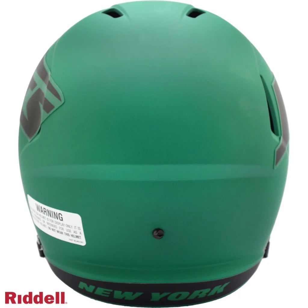 Green matte Riddell New York Jets replica football helmet with warning label