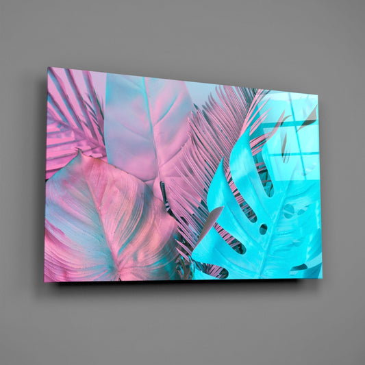 Glass wall art mounted on gray wall displaying pink and turquoise monstera leaves with black veining details.
