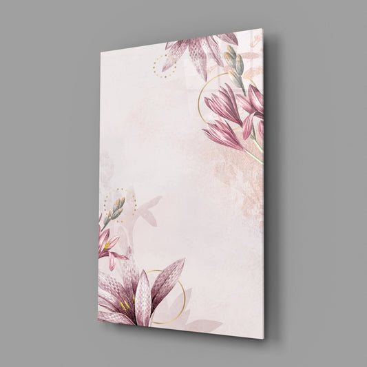 Angled perspective view of glass wall art displaying delicate pink flowers with gold accents on cream background.
